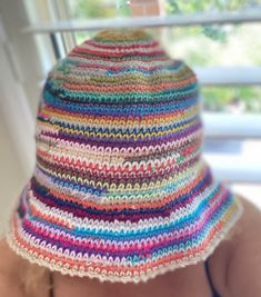 Introducing our fabulous Multi-Colored Crochet Bucket Hat, a groovy accessory that adds a touch of style to any outfit. Handcrafted with love and attention to detail, this hat is a true statement piece. Whether you're a fashion enthusiast or simply looking for a unique Mother's Day gift, this hat is the perfect choice. Featuring a delightful blend of vibrant colors, this hat exudes a playful and eye-catching appeal. The intricate crochet work showcases the craftsmanship and dedication that goes Adjustable Knitted Mini Hats, Adjustable One Size Knitted Mini Hats, Multicolor Retro Vacation Hat, Adjustable Fun Yarn Bucket Hat, Casual Colorful Adjustable Crochet Hat, Hand Knitted Crochet Hat For Festival, Hand Knitted Crochet Hat One Size For Festival, Hand Knitted One-size Crochet Hat For Festival, Casual Adjustable Colorful Crochet Hat