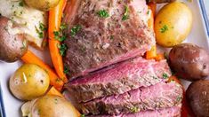 roast beef with potatoes and carrots on a plate