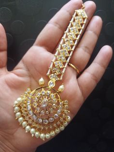 Traditional Beautiful  handcrafted Jadau designer tika in semi precious pearls and stones  ◾22 carat gold plated  ◾ Repolishable Jewellery ◾Next to real jewellery ◾copper based jewellery Gold Round Chandbalis With Stone Work, Gold Stone Work Round Chandbalis, Gold Temple Jewelry Tikka With Stone Work, Elegant Gold Tikka With Cutdana, Kundan Tikka For Temple Jewelry, Gold Chandbali Jewelry With Stone Setting, Gold Plated Chandbali Bridal Necklace With Stone Work, White Hand Set Jewelry For Eid, Elegant White Chandbalis For Ceremonial Occasions