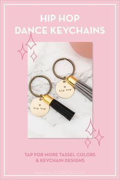 two gold and black key chains with the words hip hop dance keyschains on them