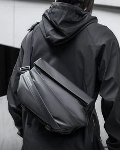 Level Up Your Urban Style with the Techwear Messenger Bag "Gama" Your browser does not support video playback. The Techwear messenger bag "Gama" redefines modern fashion with its innovative design and cutting-edge aesthetic. This futuristic bag blends practicality with a unique geometric structure that captures attention. Crafted from premium materials, this bag is perfect for techwear enthusiasts looking to enhance their everyday outfits. Whether for work or leisure, the "Gama" messenger bag is Cyberpunk Pants, Techwear Jacket, Geometric Structure, Hakama Pants, Techwear Pants, Techwear Outfits, Angular Design, Future Of Fashion, Streetwear Pants