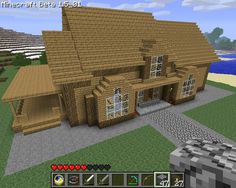 an image of a large house in minecraft with lots of wood and stone on it