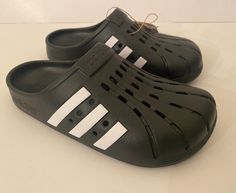 adidas ADILETTE CLOGS New with tags Unisex adidas Adilette Slip On Clogs Sandals, great for everyday comfort Core Black / Cloud White / Core Black Model: GZ5886 Please scroll down and choose the size you need, select carefully the size depends if you need it for men's or woman's ⚫⚫⚫⚫⚫⚫⚫⚫⚫⚫⚫⚫⚫⚫⚫⚫⚫⚫⚫⚫⚫⚫⚫ This will make a great Gift !!! Please contact me if you have any questions :) ~ Thank you for visit our Store ~ Terms of Sale  We ship to your eBay address. Please make sure your eBay address is Adidas Synthetic Slip-on Clogs, Black Slip-resistant Clogs For Summer, Non-slip Sports Clogs For Spring, Summer Sports Slip-on Clogs, Sporty Non-slip Clogs For Spring, Sporty Slip-resistant Clogs For Summer, Sporty Synthetic Clogs For Spring, Sporty Closed Toe Clogs For Spring, Sporty Synthetic Spring Clogs