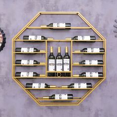 a wall mounted wine rack filled with bottles