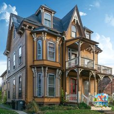 an old victorian style house with many windows and balconies