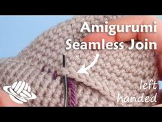 someone crocheting an amigurmi beanie with the needle pointed at it