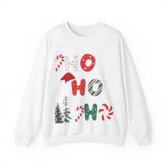 Perfect Holiday sweatshirt. HO HO HO  A unisex heavy blend crewneck sweatshirt is pure comfort. These garments are made from polyester and cotton. This combination helps designs come out looking fresh and beautiful. The collar is ribbed knit, so it retains its shape even after washing. There are no itchy side seams on these sweaters.  .: Made with a medium-heavy fabric blend of 50% cotton and 50% polyester (8.0 oz/yd² (271.25 g/m this sweatshirt feels cozy and is the perfect choice for those col White Letter Print Sweatshirt For Holidays, Cozy Christmas Sweater With Crew Neck, Sweatshirt And Shirt Outfit, Cozy Christmas Crew Neck Sweater, Outfit Ideas Shirt, Christmas Crew Neck Sweatshirt With Graphic Print, Cozy Long Sleeve Christmas Sweatshirt, Christmas Graphic Print Crew Neck Sweatshirt, Xmas Sweaters