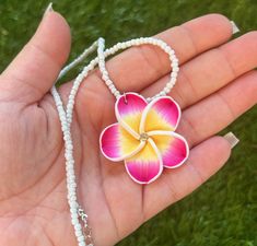 Here are some gorgeous necklaces newly available from Hawaii! The matching earrings are included as a set! These are beautifully made white beaded necklaces with a flower pendant that also has a diamond in the middle! They come in pink or purple! Makes for a beautiful gift for both adults,  kids, and anyone who wants to bring home a little aloha! 🌺 Hibiscus Flower Necklace, Hawaiian Flower Necklace, Hibiscus Necklace, Pendant Necklace Diamond, Flower Necklaces, Hawaiian Plumeria, Hawaii Jewelry, White Beaded Necklaces, Preppy Jewelry