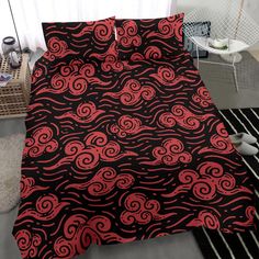 a bed with red and black designs on it