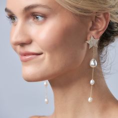 Inspired by the magic of shooting stars, these statement earrings bring a playful elegance to any outfit. Featuring a sparkling cubic zirconia star post and a graceful row of delicate pearl drops, they create a beautiful, cascading effect that flatters and illuminates the skin. Perfect for adding a whimsical yet sophisticated touch, these earrings are a stunning choice for day or night. Embrace the enchanting allure of pearls and stars with this unique, radiant pair. Details Lightweight statemen Luxury Star-shaped Earrings For Parties, Luxury Elegant Star-shaped Earrings, Luxury Star-shaped Party Earrings, Shooting Stars, Pearl Drop, Girls Best Friend, Gold Vermeil, Shop Earrings, Statement Earrings