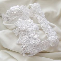 "Beautiful and lovely garter set made of white pearl beaded alencon lace. Hand sews 1\" white stretch lace. Soft and warm. Comfortable fitting garter set. Please choose your thigh size. Your garter will ship in a lovelike gift box. If you have any questions please feel free to contact me. Thanks :) ● How to measure garter size Wrap one end of the flexible measuring tape around your upper thigh. The garter is generally worn 3 to 4 inches above the knee. Please choose your natural(true) size. I re Fitted Lace Bridal Belt For Bride, Fitted Lace Trim Bridal Accessories For Bride, White Bridal Belt For Bride, Fitted White Lace For Wedding Night, Fitted White Lace Bridal Belt, White Fitted Lace Bridal Belt, Fitted White Bridal Accessories, White Fitted Bridal Accessories, Fitted White Lace For Bride