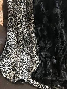 two black and white animal print blankets on a couch