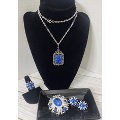 This Vintage Set From Sarah Coventry Features A Stunning Blue Starburst Design. The Set Includes A Pendant Necklace, Earrings, And A Ring. The Brand Is Well-Known For Their Unique And Timeless Jewelry Pieces, And This Set Is No Exception. The Pendant Necklace Is Perfect For Adding A Pop Of Color To Any Outfit, While The Earrings And Ring Complete The Set For A Cohesive Look. The Set Falls Under The "Jewelry Watches" And "Vintage Antique Jewelry" Categories, Specifically In The "Necklaces Pendants" Subcategory. The Style Of The Set Is Described As A Pendant, And The Brand Is Sarah Coventry. This Set Is Pre-Owned, But Its Vintage Charm And Excellent Condition Make It A Must-Have For Any Jew Blue Fine Jewelry For Party, Blue Jeweled Evening Jewelry, Blue Costume Jewelry For Formal Occasions, Sarah Coventry Jewelry, Starburst Design, Pin Earrings, Sarah Coventry, Vintage Antique Jewelry, Timeless Jewelry