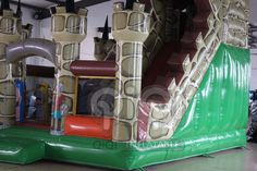 an inflatable castle with slide and slides