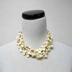 Beads:: Coconut Shell Condition: New, Old Stock Length:: 17" (19.25" Includes Extension Chain) Lobster Claw Closure (Internal Use Only: Xy-? // J22 - C.Nh.Nm // B.J22j /T0.8) White Jewelry With Wooden Beads, White Jewelry With Round Wooden Beads, White Wooden Beads Necklace For Gift, Elegant White Beaded Necklaces With Wooden Beads, Elegant White Beaded Necklace With Wooden Beads, Elegant White Wooden Beaded Necklaces, Elegant White Jewelry With Wooden Beads, White Multi-strand Necklace With Wooden Beads, White Multi-strand Beaded Necklace With Wooden Beads