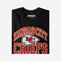 When assembling your fan fit, you need something that lets everyone know that you’re at the top of your game. Well, a stylish team top can help with that endeavor. Change the game and rep the team in this Kansas City Chiefs Arched Wordmark T-Shirt. This top features a design that showcases your all-important team colors and a bold team logo display across the chest, meaning this tshirt will prove your unmatched dedication to the Kansas City Chiefs when you’re at the game or watching at home with your friends. In other words, this graphic tee is about to be your new favorite teammate. This Kansas City Chiefs shirt is made from easy-wearing, comfortable fabric that will make this a regular t-shirt in your rotation. It also boasts a classic construction for the durability you need when you’re Black T-shirt With Team Logo For Fans, Black Team Spirit T-shirt With Letter Print, Team Spirit Streetwear T-shirt, Throwback Tops For Team Events During Sports Season, Throwback Black T-shirt For Sports Events, Collegiate Black T-shirt For Sports Season, Black T-shirt With Letter Print For Game Day, Black Graphic Tee With Team Logo, Sporty Crew Neck T-shirt For Fan Events