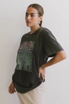 Crew Neckline Short Sleeves Psychedelic Tiger Graphic Stretch Knit Material 100% Cotton Machine Wash Cold, Tumble Dry Low Model Info Height: 5'8" Wearing Size: X-Small ~section 2~ SIZE US SIZE BUST LENGTH X-Small (00-0) 40" 28" Small (2-4) 42" 28.5" Medium (6-8) 44" 29" Large (10-12) 46" 29.5" X-Large (14-16) 48" 30" **For more specific information on the product, please feel free to email us at webteam@bohme.com Retro Black T-shirt For Fall, Black T-shirt For Fall Music Festival, Bohemian Graphic Print Tops For Streetwear, Casual Washed Black Top For Concert, Black T-shirt For Spring Music Festival, Black T-shirt For Music Festival In Spring, Spring Black T-shirt For Music Festival, Green Crew Neck Top For Concert, Black Relaxed Fit Top For Music Festival