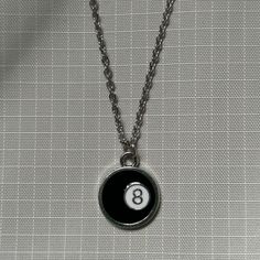 Lucky 8 Ball Necklace ⭑ Water Safe & Tarnish Free Chain ⭑ Available in 3 Different Lengths ⭑ Chain Material - Stainless Steel ⭑ Charm Dimensions - 16mm x 20mm ⭑ UK SHIPPING - Shipping to the UK is completely free with no minimum spend requirement. ⭑ INTERNATIONAL SHIPPING - Shipping to everywhere else in the world is just £3. Any additional items ordered within the same order are shipped with no extra shipping charge. Lucky 8 Ball, 90s Inspired Fashion, Necklace Y2k, Mens Necklace Pendant, Silver Chain For Men, Necklace Mens, Jewelry Mens, Silver Necklaces Women, Mens Silver Necklace