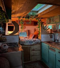 the interior of a small home with wood paneling and green cabinets, including an oven