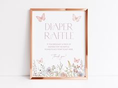 a pink and gold framed sign with butterflies on it that says diaper raffle