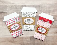 three small envelopes with hearts on them, one is for someone's birthday