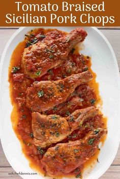 tomato braised sicilian pork chops on a white plate