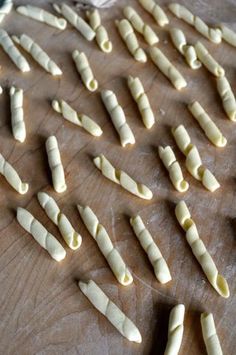 several pieces of pasta on a wooden table