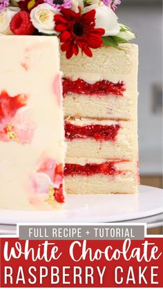 a white chocolate raspberry cake with flowers on top and the words full recipe