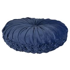 a blue round pillow with ruffles on the top and bottom, sitting in front of a white background