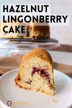 a piece of cake on a plate with the words hazlenut lingonberry cake