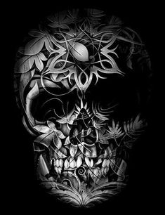 a black and white photo of a skull with flowers on it's head, in the dark