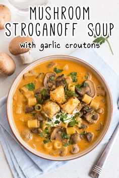 mushroom stroganoni soup with garlic croutons in a bowl