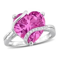 Introducing the captivating Created Pink Sapphire and Diamond Accent Heart Wrapped Ring in Sterling Silver, a stunning symbol of love and elegance. This enchanting ring features a heart-shaped Created Pink Sapphire, totaling 7 1/4 carats, embraced by a delicate wrapping of sparkling Diamond Accents. Crafted with precision in Sterling Silver, the ring exudes sophistication and modern charm. The combination of the vibrant pink sapphire and the shimmering diamonds creates a romantic and timeless de Heart Shaped Jewelry With Accent Stones For Proposal, Heart-shaped Jewelry With Accent Stones For Proposal, Heart Shaped Jewelry With Accent Stones For Valentine's Day, Heart-shaped Jewelry With Accent Stones For Valentine's Day, Heart-shaped Valentine's Day Jewelry With Accent Stones, Heart-shaped Diamond Ring With Accents For Valentine's Day, Pink Heart-shaped Jewelry For Proposal, Valentine's Day Heart Cut Ring With Diamond Accents, Valentine's Day Heart Cut Rings With Diamond Accents