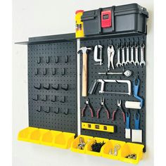 a tool rack with tools hanging on the wall next to it's pegboard