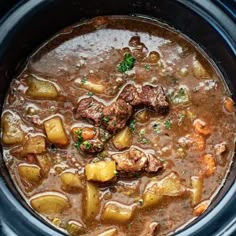 beef stew with potatoes and carrots in a slow cooker