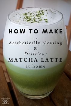 a close up of a drink in a glass on a wooden table with the words how to make an aesthetically pleasing and delicious matcha latte at home