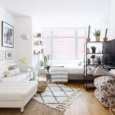 a living room filled with furniture and a flat screen tv