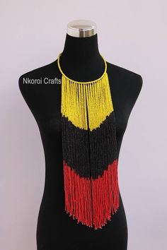 African beaded necklaces, African beaded jewelry, Beaded women jewelry, Christmas gift for her, Moms gift, Fringe necklace, Gift for her An elegant necklace that can match any outfit. Handmade by the Maasai women in Kenya using fine beads. Color: yellow, black and red 3-5 days delivery via DHL Express. Pay shipping fee for the first item only and additional items ship for free. To view more items in our shop, kindly click here: nkoroicrafts.etsy.com Yellow Beaded Necklaces With Faceted Beads For Gift, Gift Beaded Necklaces With Dangling Round Beads, Yellow Beaded Necklace With Dangling Beads As Gift, Yellow Faceted Beads Necklace As Gift, Yellow Faceted Beads Necklace For Gift, Yellow Polished Beads Necklace For Gift, African Beaded Jewelry, Kenyan Flag, Native Dress