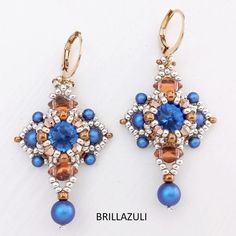 a pair of earrings with blue and brown beads