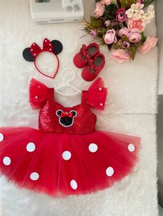 a red minnie mouse outfit and matching headband