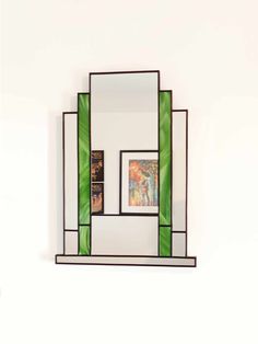 a mirror that is sitting on top of a shelf