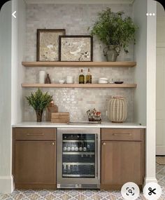 a kitchen with open shelving and an oven in the center, surrounded by potted plants