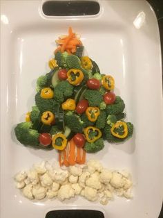 a christmas tree made out of broccoli, cauliflower and carrots