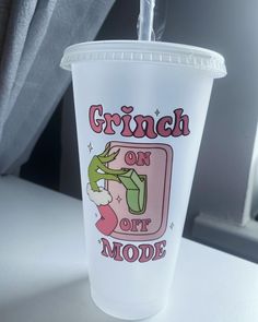 a plastic cup with the words grin on it