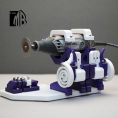 a robot that is made out of legos and has a machine attached to it