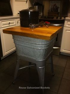 a kitchen with an old fashioned ice chest on the counter