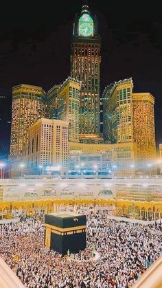 an aerial view of the kabab and surrounding buildings at night with many people