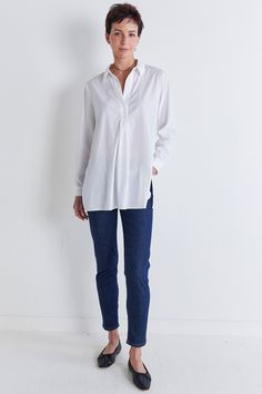 A perfectly oversized tunic style top to wear over your favorite leggings or fitted pants for a chic, effortless style. Oversized fit Collared Lightweight fabric Tunic style Oversized Shirttail Hem Shirt For Layering, Oversized Shirt With Shirttail Hem For Layering, Casual Workwear Tops With Curved Hem, Oversized Casual Blouse With Curved Hem, Casual Tops With Curved Hem For Work, Casual Tops With Curved Hem For Daywear, Relaxed Fit Blouse With Shirttail Hem For Daywear, Relaxed Fit Blouse With Shirttail Hem And Placket, Curved Hem Tops For Daywear In Spring