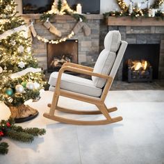 a rocking chair sitting in front of a christmas tree