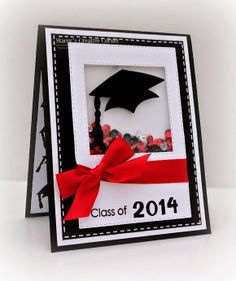 a graduation card with a red ribbon and a graduate's cap in the center